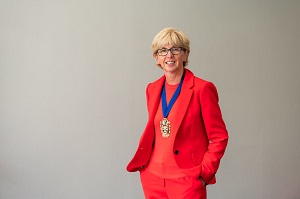 Headshot of Caroline Rassell with CIPFA President's medal